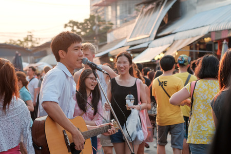 Bagkok, Thailand - Circa March 2015: Unidentified youung man sings at the Chatujak weekend market. Chatujak is the largest weekend market in Bangkok.のeditorial素材
