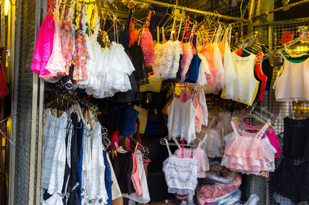 BANGKOK, THAILAND - CIRCA JULY 2015: Clothes for sale at Chatuchak weekend market. It is one of the largest market in Asia.のeditorial素材
