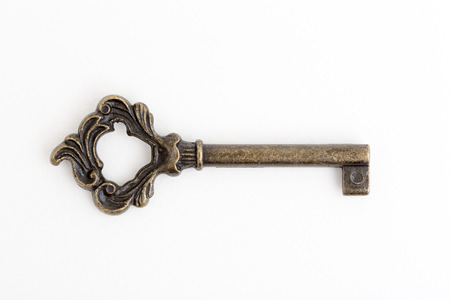 Vintage old bronze skeleton key with holeの写真素材