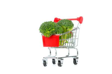 Red shopping cart isolated on white bacngroundの写真素材