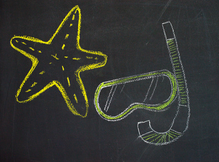 Chalk cartoon drawn on black black boardの写真素材