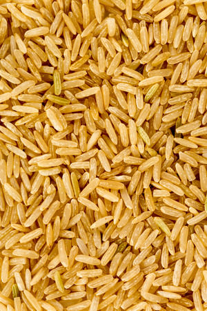 Texture of natural brown rice grain in a pileの写真素材