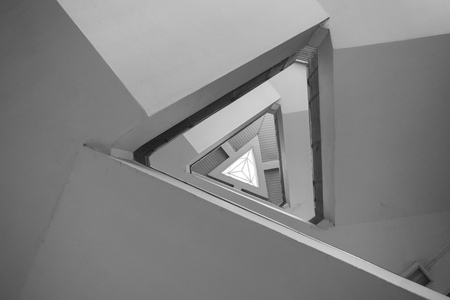 Triangular stair case architectural style looking up