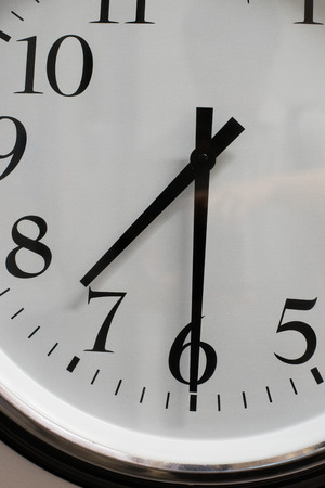 Close up on clock hanging on the wall