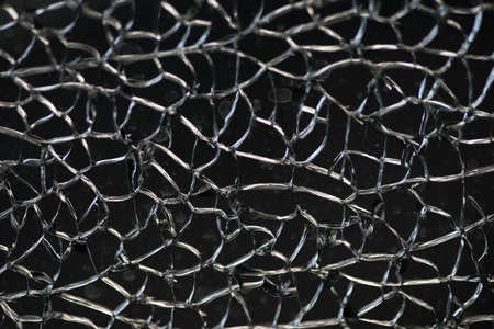 Damaged glass window fracture texture, close upの写真素材