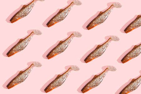 gold fishes pattern on a pink bacgroundの写真素材