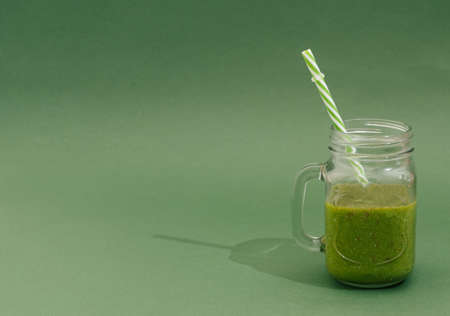 fesh healthy vegan juice on a red backgroundの写真素材