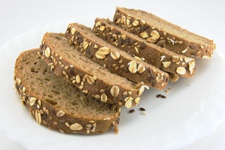 Five slices of rye bread on a white plate