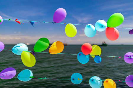 Colorful balloons and sea
