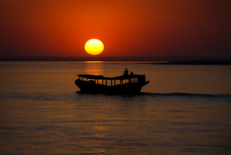 Irrawaddy sunset with a shadow of the boatの写真素材