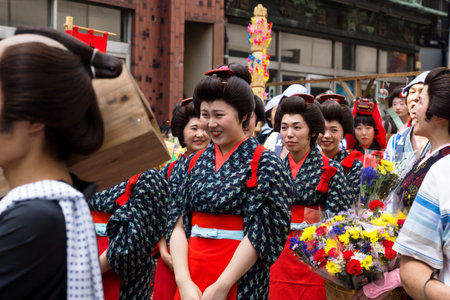 Tokyo, Japan - September 24 2017: Women dressed in red and black Edo customes and flower seller at Shinagawa Shukuba Matsuri festivalのeditorial素材