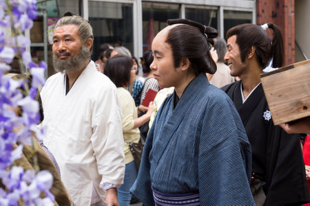 Tokyo, Japan - September 24 2017: Three man in Edo costumes and visitors at the parade of Shinagawa Shukuba Matsuri festivalのeditorial素材