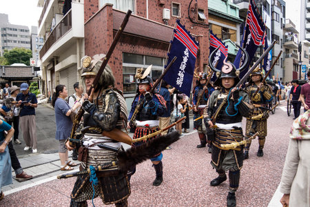 Tokyo, Japan - September 24 2017: People with samurai costumes walking along the parade with visitors along the street at Shinagawa Shukuba Matsuri festivalのeditorial素材