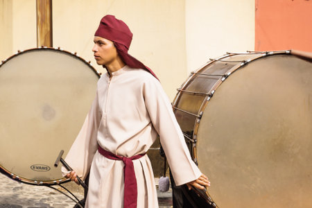 Antigua, Guatemala: March 18 2018: Man with large drums at the procession of San Bartolome de Becerra in 1a Avenidaのeditorial素材
