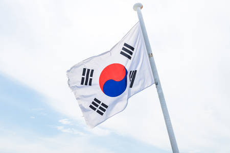 Korean flag with wind on white cloud with blue in the edge