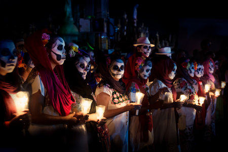 Merida, Cementerio General, Mexico - 31 October 2018: Line of customed women dressed as Catrinas with skull make-up and candles at the event for dia de los muertos at the Festival Des Las Animasのeditorial素材