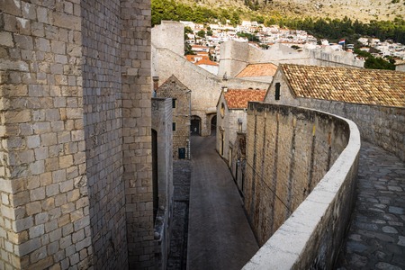 Entrance of the fort of Dubrovnik with cobbled street seen from the upper wall, Croatiaの写真素材