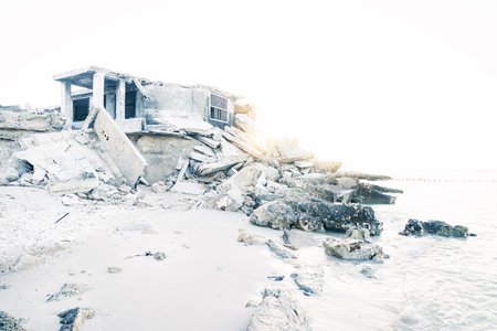 Abandoned falling apart house during sunset at the beach in Chelem, Mexicoの写真素材