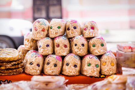Mexican sugar skull candy with quinoa, calaveras, traditionally used for dias de los muertos, halloween at the market of Merida, Mexicoの写真素材