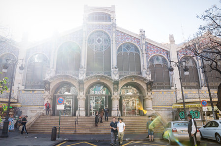 Valencia, Spain - 17 February 2020: Front view on the Mercado Central and visitors with backlight