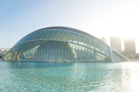 Valencia, Spain - 17 February 2020: Hemispheric along pond with skyscapers in the City of Arts and Sciences designed by architects Santiago Calatrava and Felix Candelaのeditorial素材