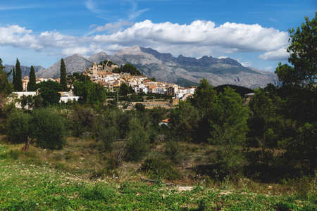 Sunny panorama view on the hills of Polop de Marina surounded by green forest at the Costa Blanca, Spainの写真素材