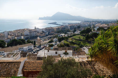 Sunlit coast with mountain and view over Altea with harbour seen from the old town outlook, Costa Blanca, Spainの写真素材