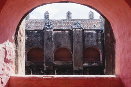 View through orange arch int the former monestary Convent de San Bernardino de Siena in Valladolid, Yucatan, Mexicoの写真素材