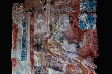 Palenque, Chiapas, Mexico - 22 May 2019: Colored basrelief carving of Mayan king and signs in the...