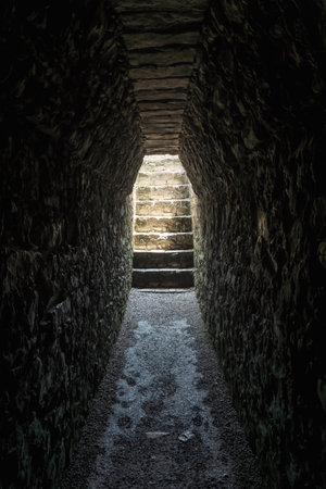 Dark tomb tunnel in the ruin palace at the archealogical site of Palenque, Chiapas, Mexicoの写真素材
