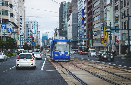 Hiroshima, Japan - 16 September 2017: Hiroshima downtown with new tram on electric railway in busy streetのeditorial素材