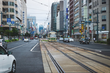 Hiroshima, Japan - 16 September 2017: Hiroshima downtown with old tram on electric railway in busy streetのeditorial素材
