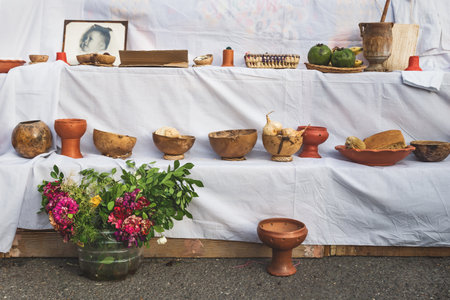 Merida, Mexico: 28 October 2018 - Traditional 'dia de los muertos', day of the dead, altar with food offerings, flowers and photo of deceasedのeditorial素材