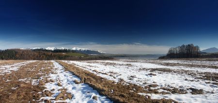 Autumn fields and snowの写真素材