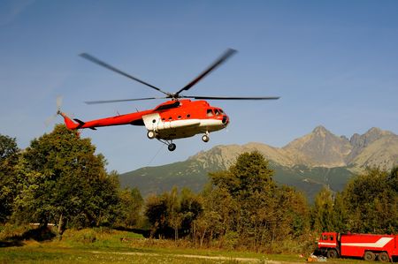 Helicopter flihgt under  mountains