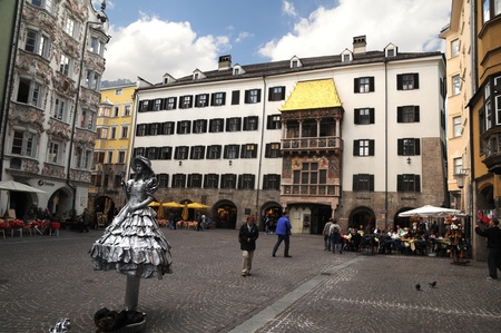 Innsbruck, Austria, May , 2011 - Exhibition: A street artist performing in front of The golden roof on the main historical square in Innsbruck.Austria.のeditorial素材