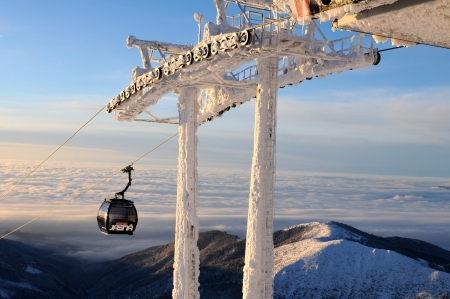 Jasna, Slovakia, Januar 2013:Modern cabin cable car in Slovak ski resort above the clouds clearのeditorial素材