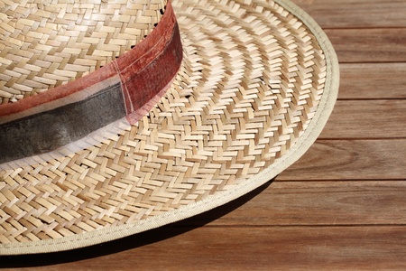details of a straw hat on a wooden tableの写真素材