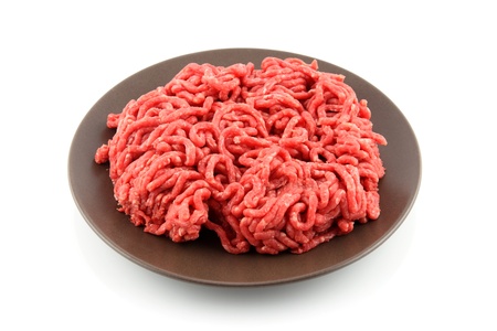 details of ground meat in plate isolated on whiteの写真素材