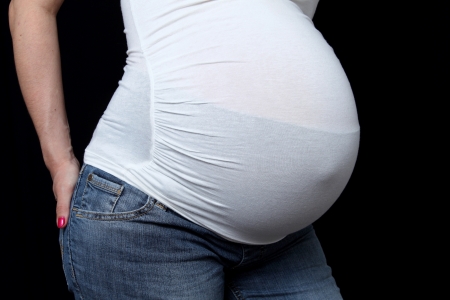 details of side view of a belly of pregnant womanの写真素材