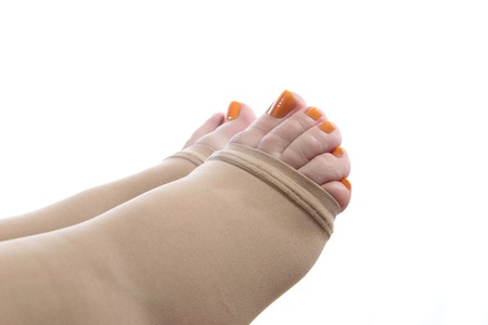 details of  feet of a pregnant woman with a compression stockingの写真素材