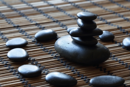 details of a tranquil scene, made with a stack of black pebbles.の写真素材