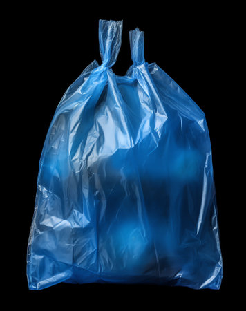 Generative AI Macro photography of green plastic bag isolated on black background. Plastic bag is a common form of packaging.の素材