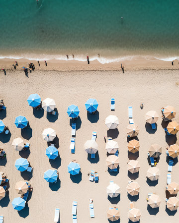 Amazing white beach in the natural reserve from above view. White umbrellas and beach loungersの素材