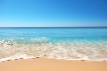 Waves breaking on empty beach on a clear spring day in Povoa de Varzim, Portugal.の素材