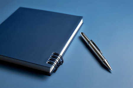 Closeup of notepad for agenda kept on table in empty corporate conference room before business meetiの素材
