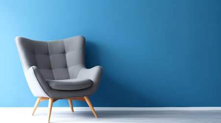 Empty room with a blue chair on a white wall backgroundの素材