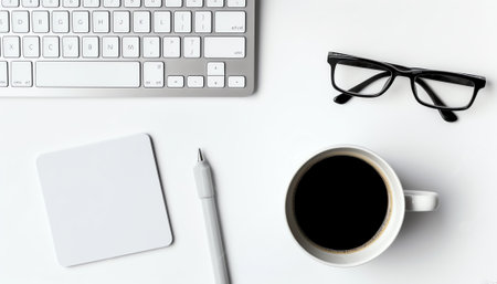 Top view of white office desk with laptop, smartphone, cup of coffee and supplies. Top view with copの素材