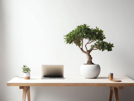 Workspace with book, clock and tree pot on wood table with living room white wallの素材