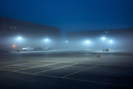 Big deserted urban city parking lot and garage at night in Chicago.の素材